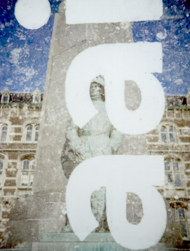 Antwerp by association, double exposed polaroid. Combination of a statue of a fallen soldier and the word aai /pet or stroke to comfort some-one.