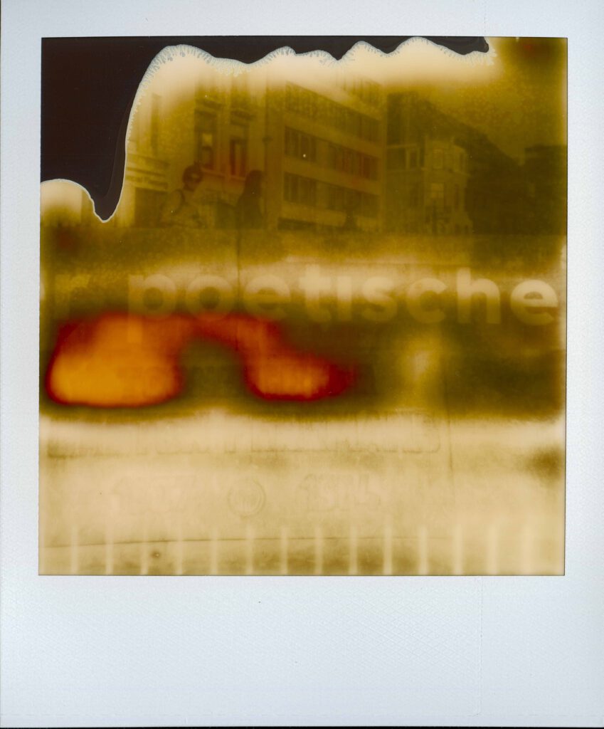 Old polaroid creating a small colourful abstract picture. This one is ever so slightly showing a word… Number 20 of the project