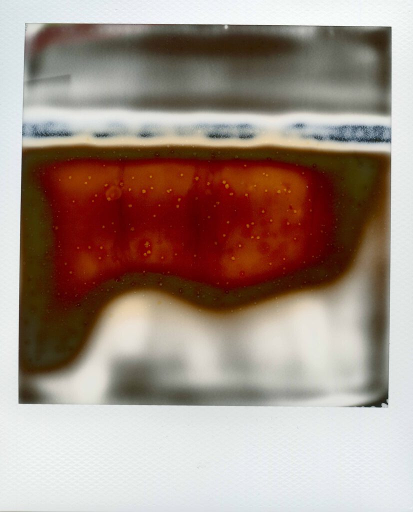 An old polaroid creating a small colourful abstract picture. Number 38 of the project