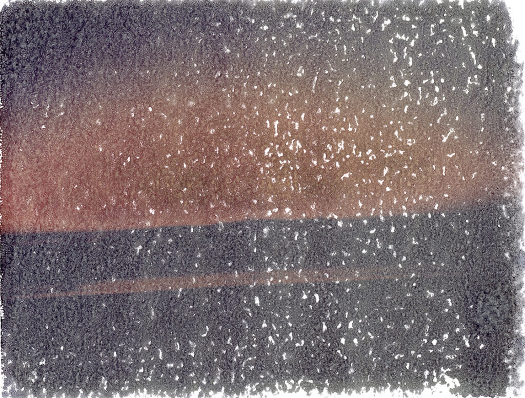 Polaroid transfer onto Arches Platine paper showing sunset west coast of Portugal - north beach Nazaré