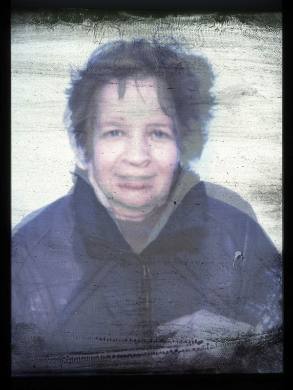 Grandmother and granddaughter superimposed, peeled polaroids. The polaroids were placed on top of each other and scanned, thus creating one image.