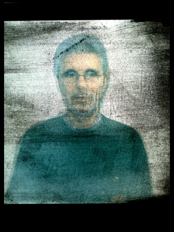 Father and son superimposed, peeled polaroids. The polaroids were placed on top of each other and scanned, thus creating one image.
It visually turns two people into one. But who wants that? We are not I